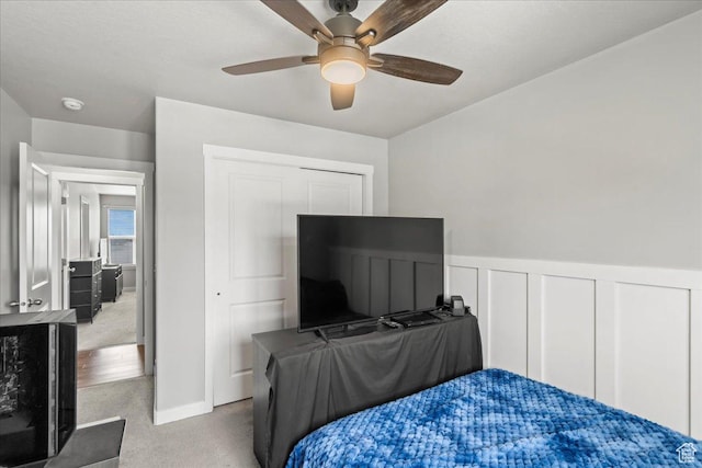 971 W Farnham Dr, North Salt Lake, UT 84054 - carpeted bedroom with wainscoting, a ceiling fan, and a closet