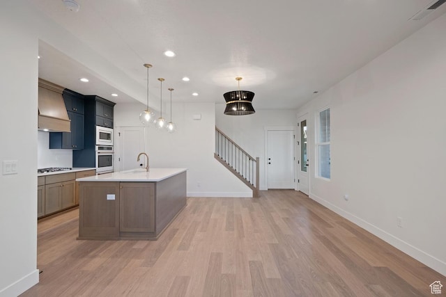 11419 S Watercourse Rd Unit 188, South Jordan, UT 84009 - kitchen with wall oven, stainless steel gas cooktop, white microwave, light wood-style flooring, and recessed lighting
