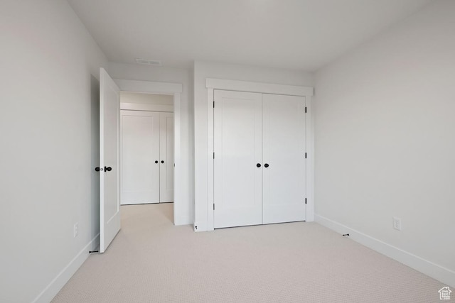 11419 S Watercourse Rd Unit 188, South Jordan, UT 84009 - unfurnished bedroom featuring light carpet, baseboards, and a closet