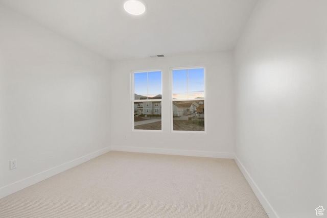 11419 S Watercourse Rd Unit 188, South Jordan, UT 84009 - spare room with baseboards and light colored carpet