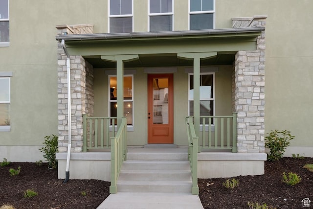 11419 S Watercourse Rd Unit 188, South Jordan, UT 84009 - entrance to property with stucco siding, stone siding, and a porch