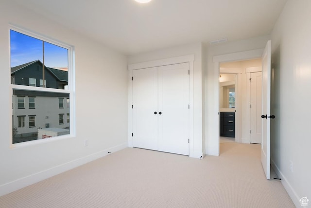 11419 S Watercourse Rd Unit 188, South Jordan, UT 84009 - unfurnished bedroom with light carpet, baseboards, and a closet