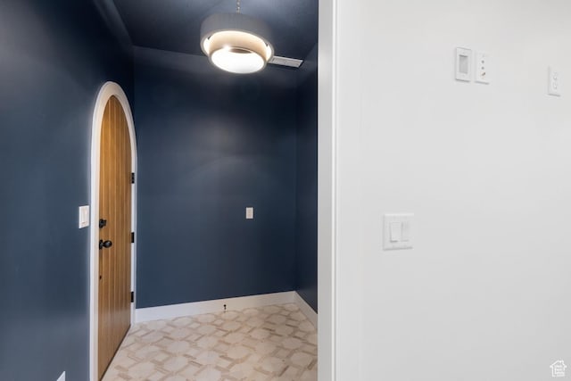 11419 S Watercourse Rd Unit 188, South Jordan, UT 84009 - entryway with arched walkways, light floors, and baseboards