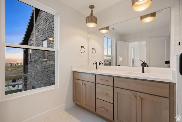 11419 S Watercourse Rd Unit 188, South Jordan, UT 84009 - full bathroom featuring marble finish floors, baseboards, and double vanity
