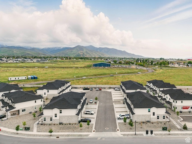 aerial view of residential area featuring mountains