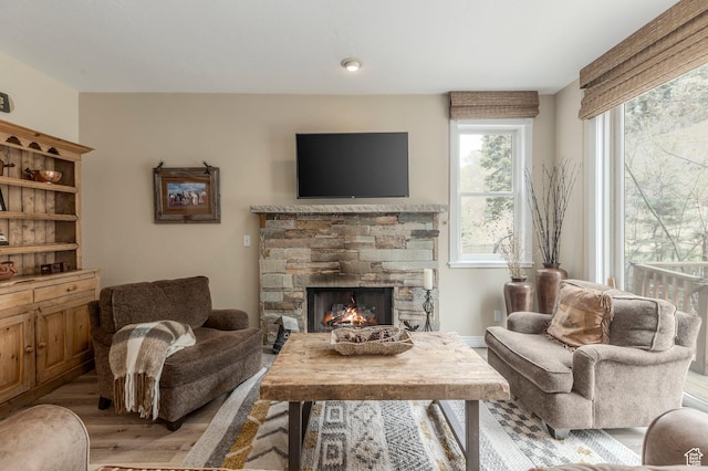 121 Daly Ave, Park City, UT 84060 - living room featuring a stone fireplace and light wood finished floors