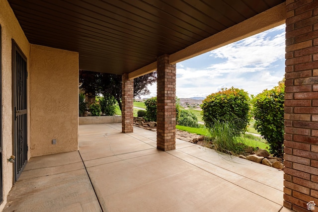 view of patio / terrace with a mountain view