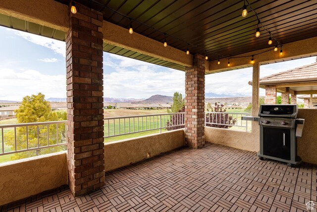 view of patio featuring a grill and a mountain view