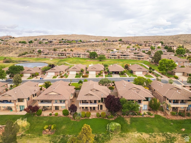 aerial view of residential area with a water and mountain view