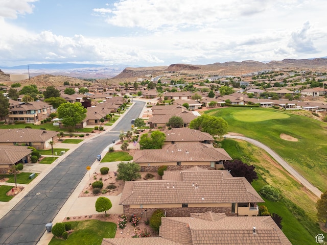 aerial view of residential area featuring a mountain backdrop