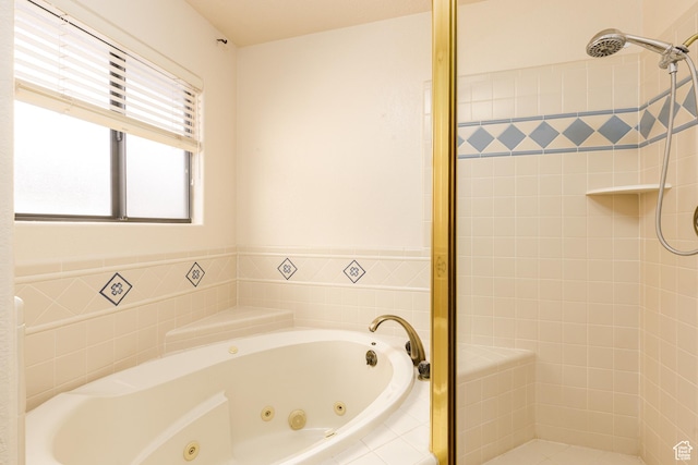 full bath featuring a shower stall and a tub with jets