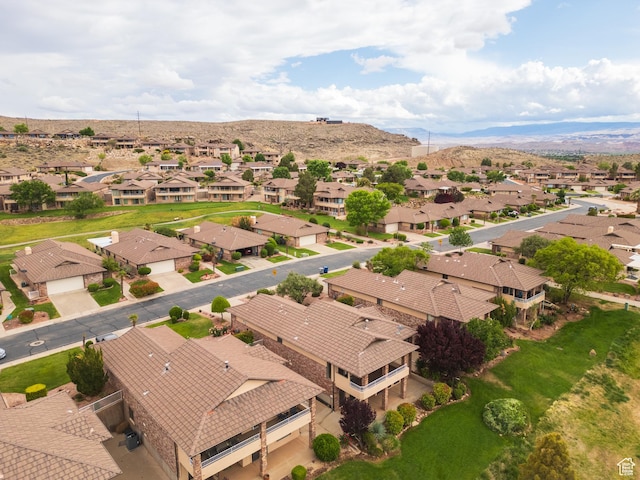 aerial perspective of suburban area with a mountainous background