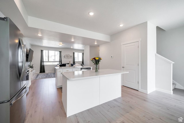 983 W 540 S, American Fork, UT 84003 - kitchen with freestanding refrigerator, a kitchen island, white cabinets, recessed lighting, and light wood-style flooring