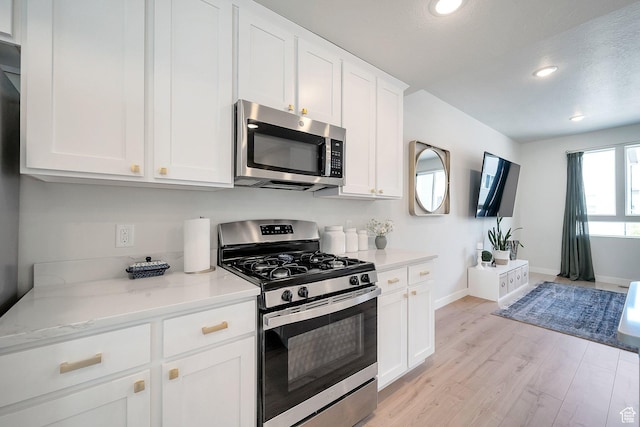 983 W 540 S, American Fork, UT 84003 - kitchen with stainless steel appliances, recessed lighting, light wood-style flooring, baseboards, and white cabinets