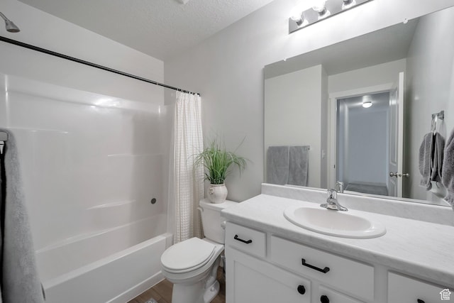 983 W 540 S, American Fork, UT 84003 - bathroom with toilet, vanity, wood finished floors, shower / bath combo, and a textured ceiling