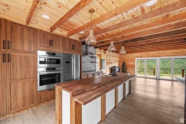 kitchen with wooden counters, stainless steel appliances, wood ceiling, light wood-type flooring, and beam ceiling