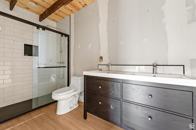 full bath featuring wooden ceiling, tiled shower, toilet, double vanity, and wood finished floors