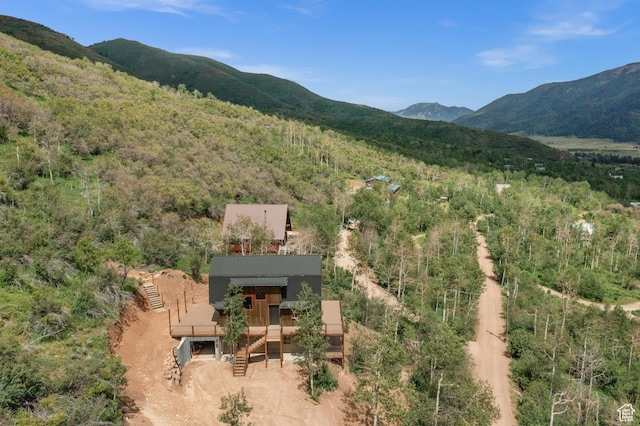view of mountain background with a heavily wooded area