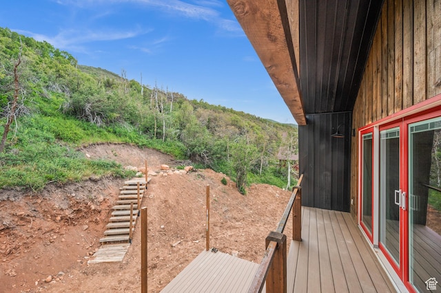 balcony with a mountain view and a wooded view