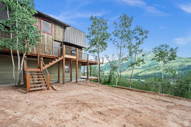 view of yard featuring a wooden deck and stairs