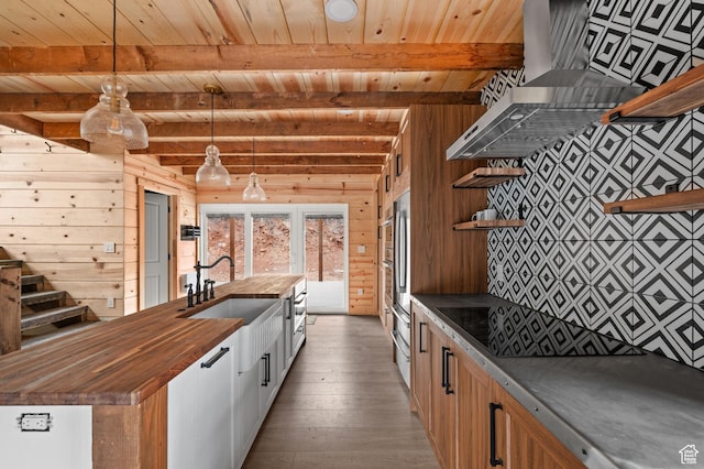kitchen with wood counters, open shelves, wood ceiling, wood walls, and hardwood / wood-style flooring