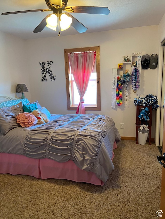 bedroom with carpet floors, ceiling fan, and baseboards
