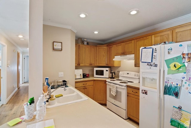 kitchen with white appliances, under cabinet range hood, ornamental molding, a sink, and light countertops