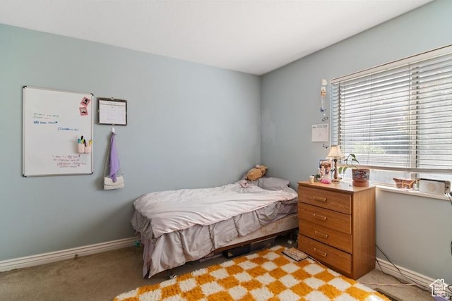 bedroom featuring light colored carpet