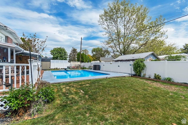 view of pool with a shed, an outdoor structure, and a diving board