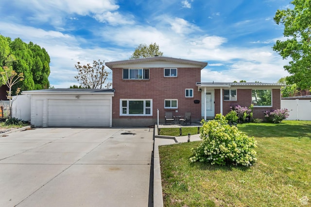 split level home with a garage and concrete driveway