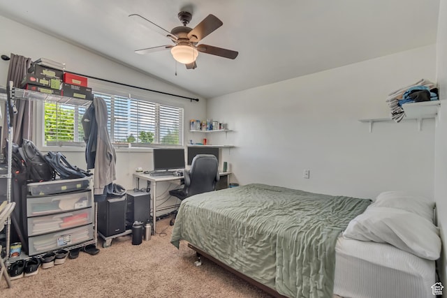 bedroom featuring vaulted ceiling, carpet floors, a ceiling fan, and a desk
