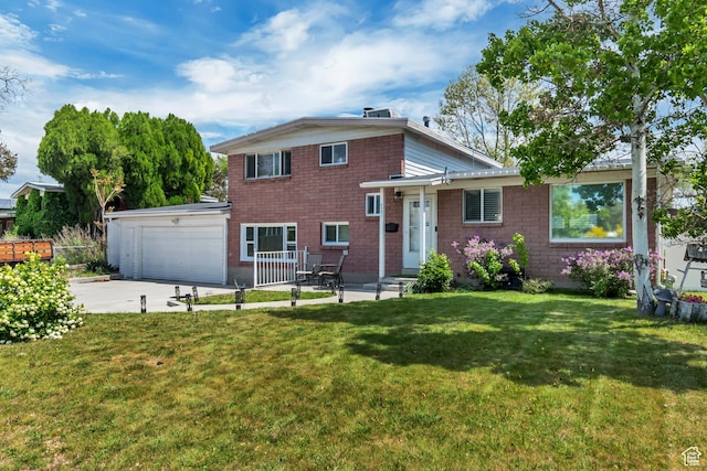 tri-level home with concrete driveway, a front yard, and an attached garage
