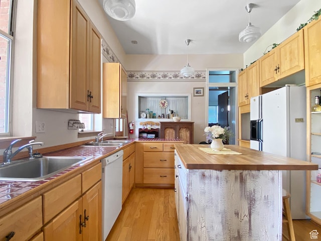244 S Main St W, Ephraim, UT 84627 - kitchen with white appliances, a sink, wooden counters, and a kitchen bar