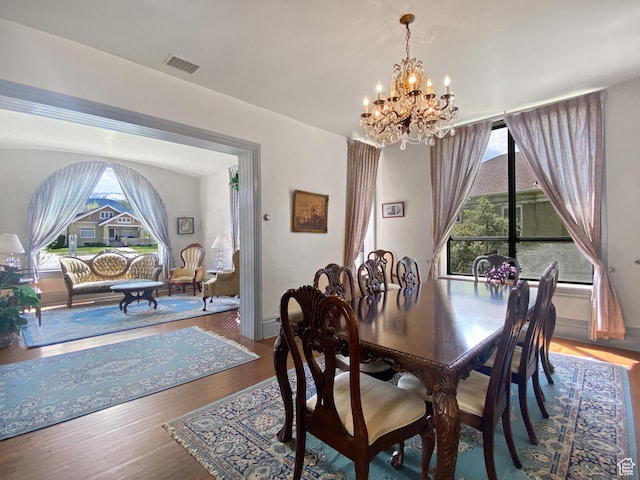244 S Main St W, Ephraim, UT 84627 - dining space featuring a chandelier, plenty of natural light, wood finished floors, and baseboards