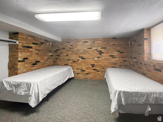 244 S Main St W, Ephraim, UT 84627 - bedroom featuring brick wall, carpet, and a textured ceiling