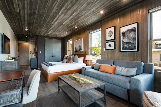 living area featuring hardwood / wood-style floors, healthy amount of natural light, wood ceiling, and recessed lighting