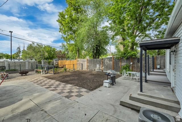 21 E Angelo Ave S, South Salt Lake, UT 84115 - view of patio / terrace with cooling unit, a fire pit, a fenced backyard, and a grill