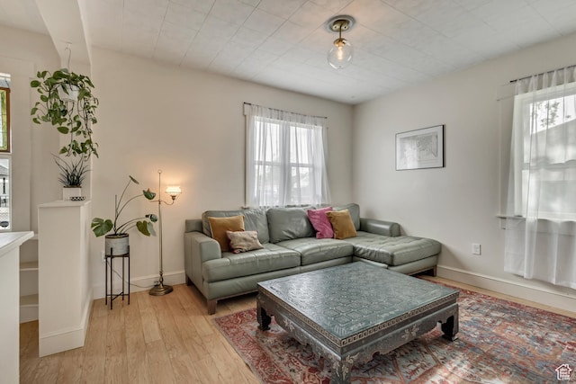 21 E Angelo Ave S, South Salt Lake, UT 84115 - living room with light wood-style flooring and baseboards