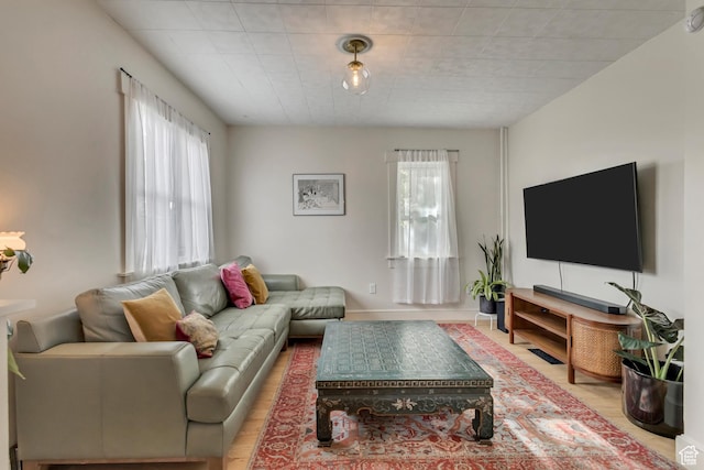 21 E Angelo Ave S, South Salt Lake, UT 84115 - living room featuring light wood-style floors