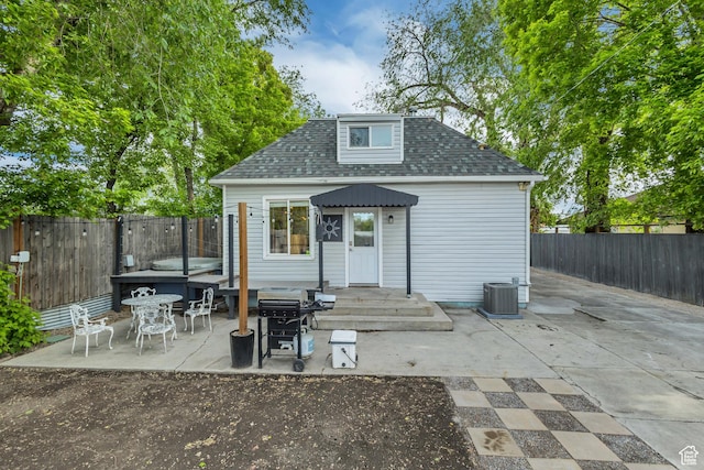 21 E Angelo Ave S, South Salt Lake, UT 84115 - back of property with a fenced backyard, a patio, roof with shingles, an outbuilding, and central air condition unit