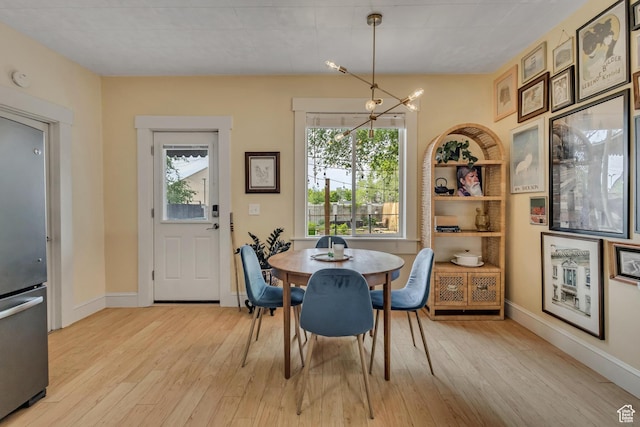 21 E Angelo Ave S, South Salt Lake, UT 84115 - dining area featuring plenty of natural light, light wood-style flooring, and baseboards