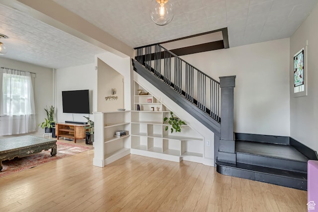 21 E Angelo Ave S, South Salt Lake, UT 84115 - staircase featuring wood-type flooring and built in features