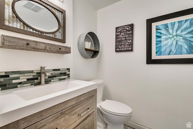 1343 S 200 E, Farmington, UT 84025 - bathroom featuring backsplash, toilet, vanity, and baseboards
