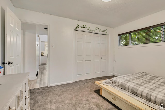1343 S 200 E, Farmington, UT 84025 - bedroom featuring light colored carpet, baseboards, and a closet