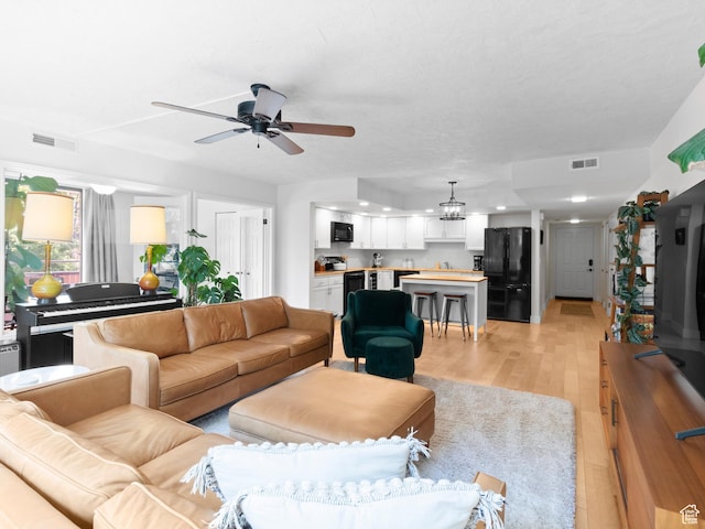 141 E Second Ave N Unit 502, Salt Lake City, UT 84103 - living area with a ceiling fan, light wood finished floors, recessed lighting, and a chandelier
