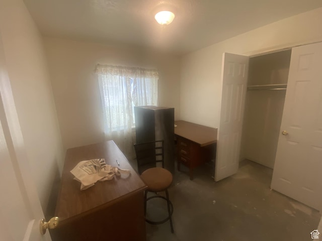 50 S 400 E, Myton, UT 84052 - bedroom with unfinished concrete flooring and a closet