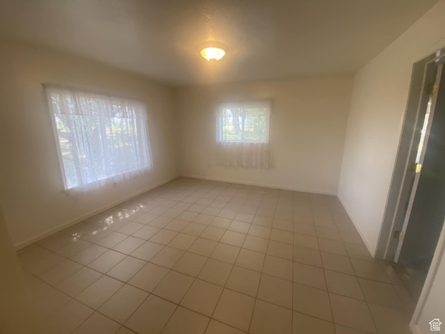 50 S 400 E, Myton, UT 84052 - spare room featuring light tile patterned floors and baseboards
