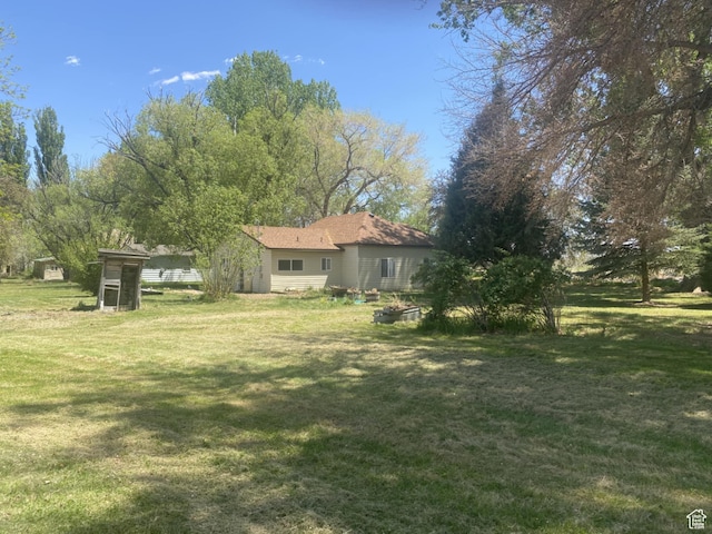 50 S 400 E, Myton, UT 84052 - view of grassy yard featuring an outdoor structure
