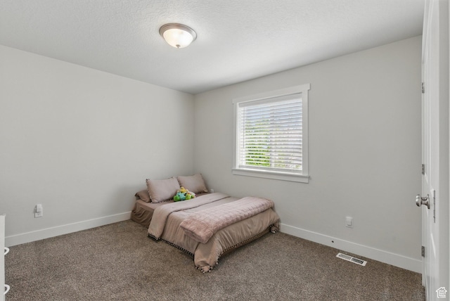 bedroom with carpet floors and baseboards