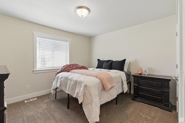 carpeted bedroom featuring baseboards